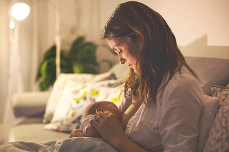 Woman breastfeeding baby